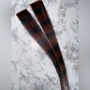 Brown and black raccoon tail extensions